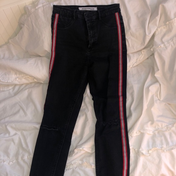 black jeggings with red stripe